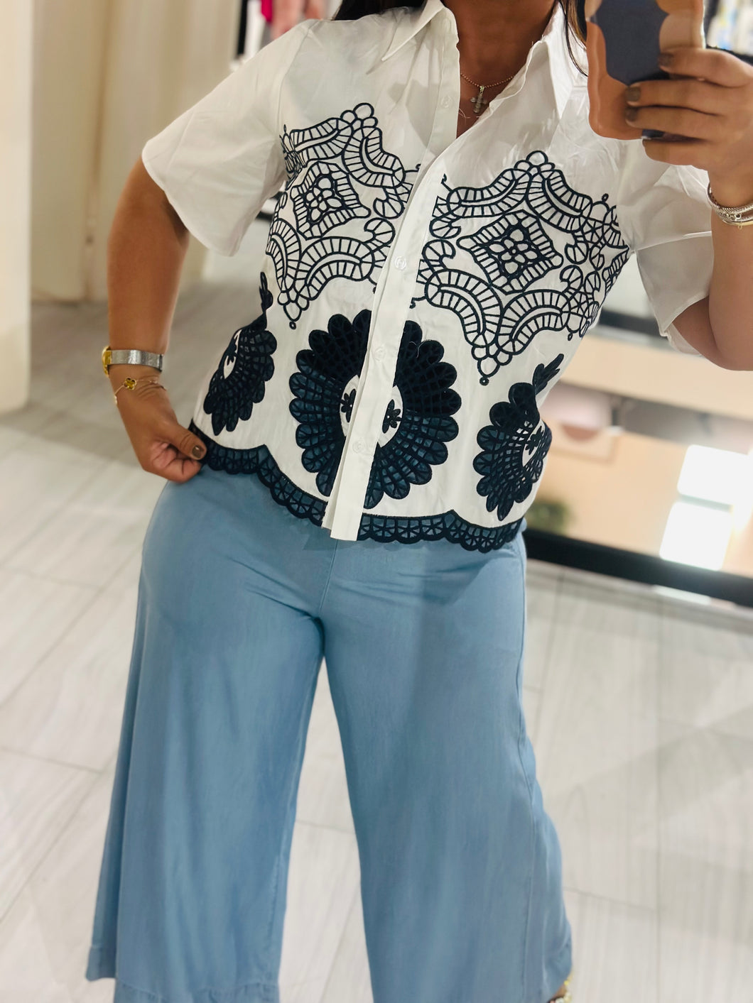 Top embroidery detail button
